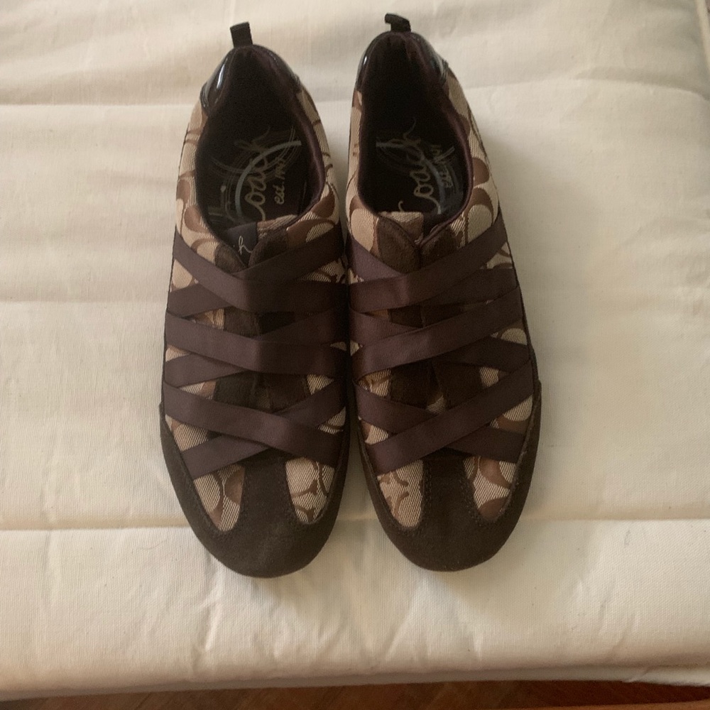 Coach Brown slip on sneakers.